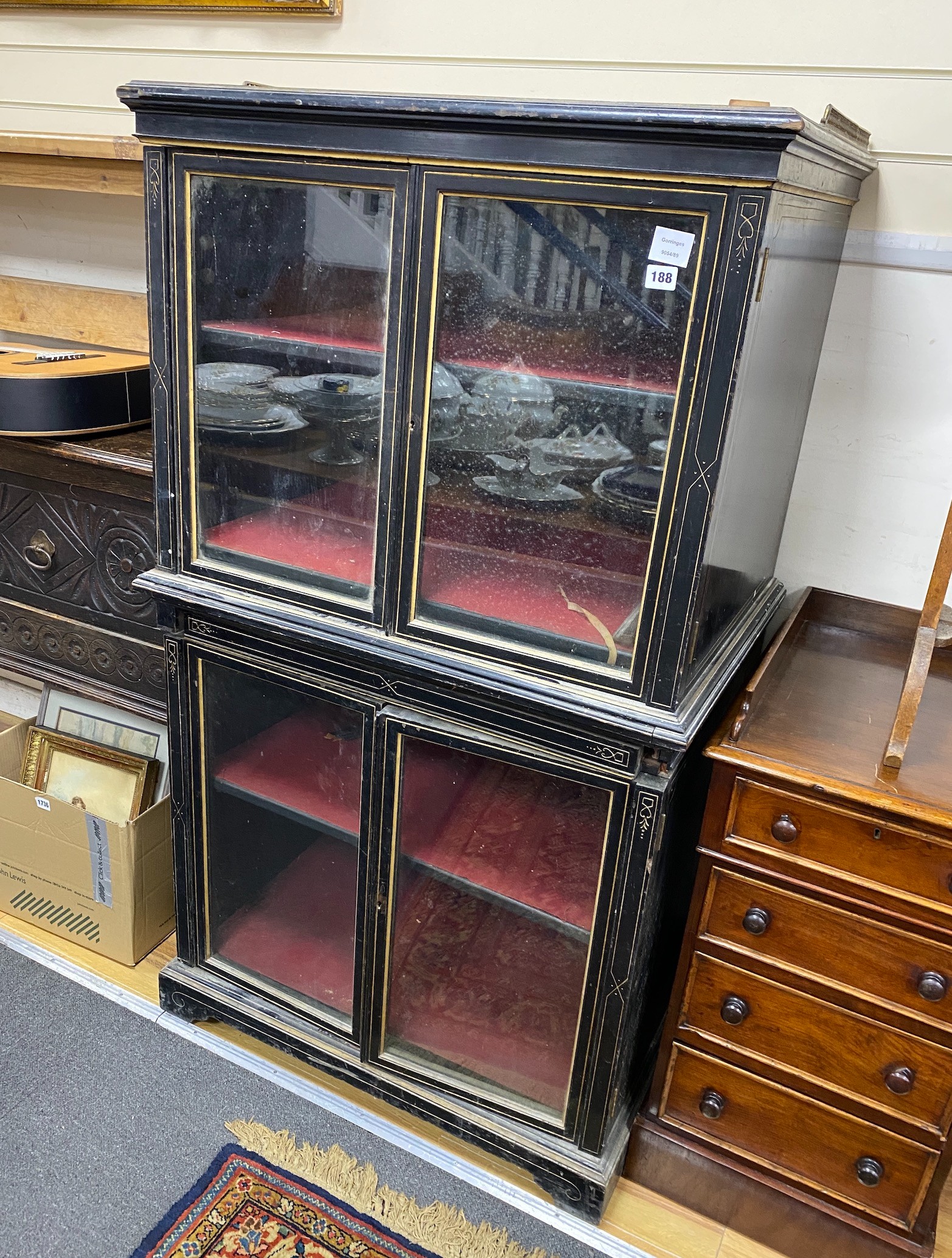 A late Victorian ebonised and parcel gilt collector's cabinet in two parts, width 80cm, depth 60cm, height 146cm